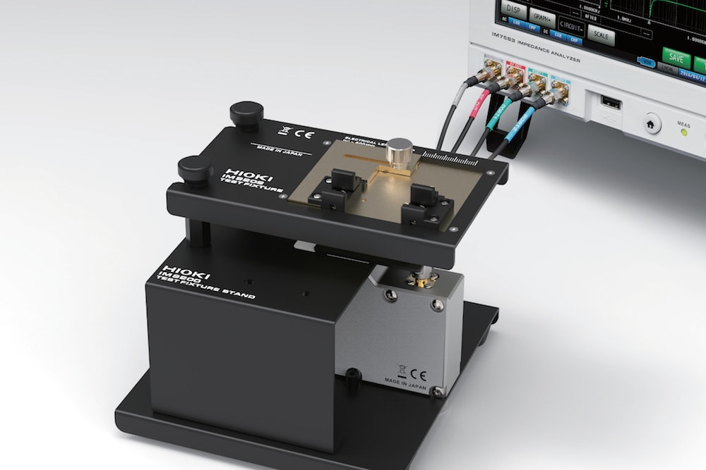 Test fixture takes irregular shapes for surface mount and leaded